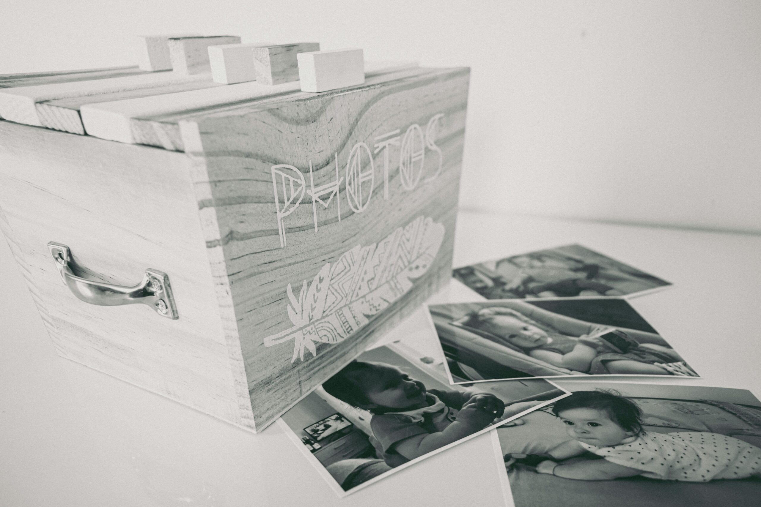 A foster child looking through family photo albums, showcasing the emotional impact and importance of preserving visual memories