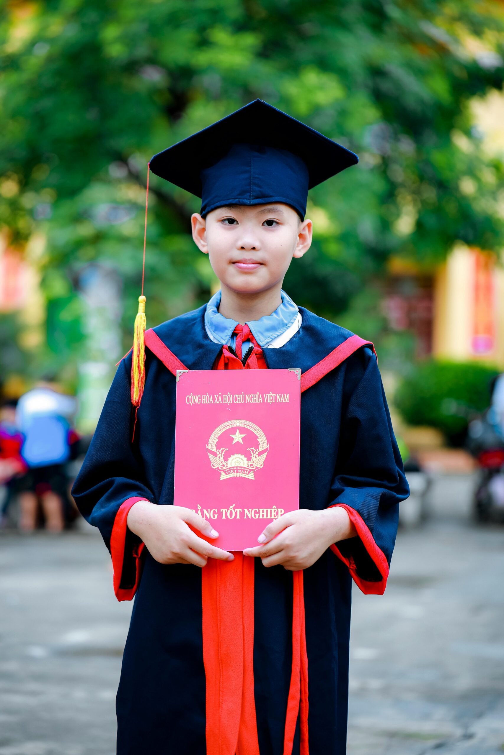 Young Graduate Posing with His Diploma