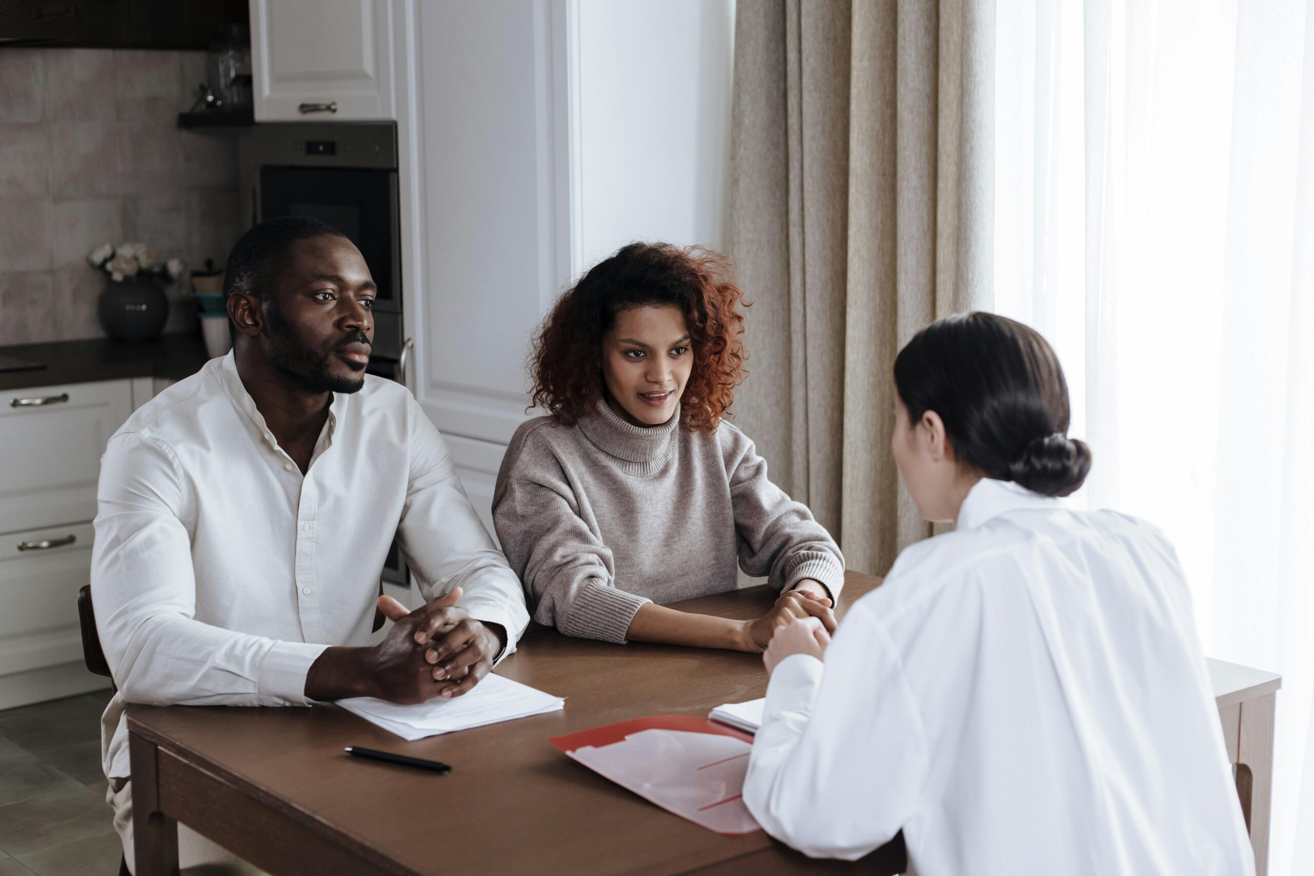 A Social Worker Talking to a Couple